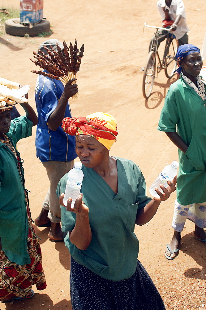 On the road to Kampala, there are numerous opportunities to purchase food, water and even live chickens at various trade spots along the way.  You don't even need to get off the bus. Northern Uganda, East Africa