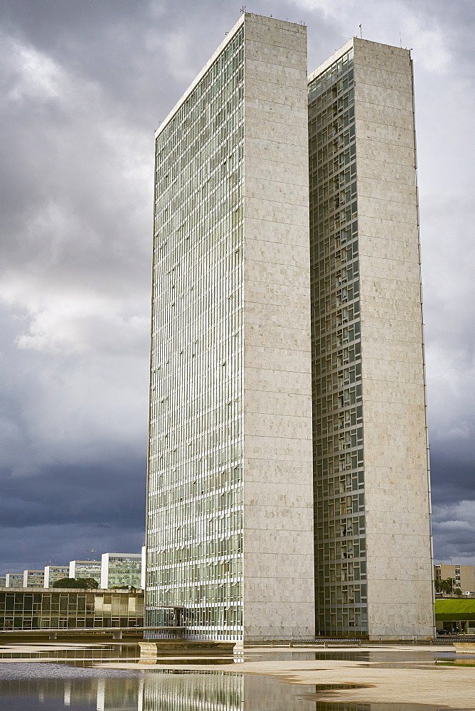 Twin towers of the National Congress designed by Oscar Niemeyer, 1958, at the heart of the Pilot Plan, with Ministries in the background, Brasilia, UNESCO World Heritage Site, Brazil, South America