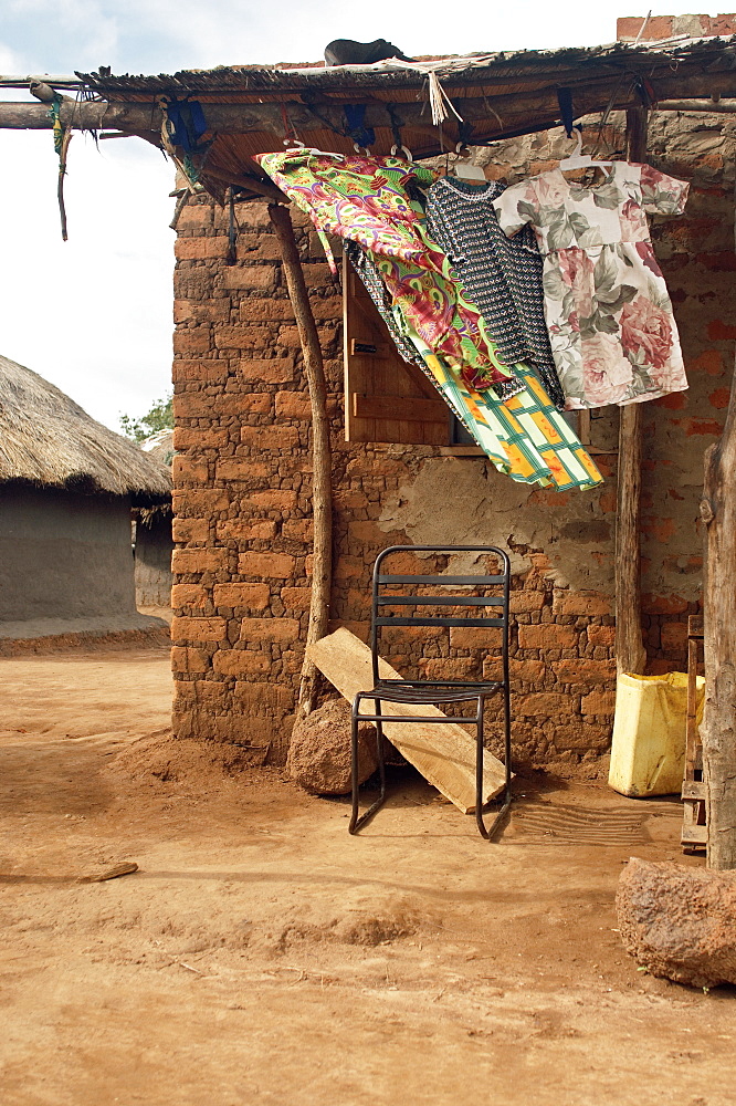 One of the more substantial dwellings in Te-Tugu IDP camp, made from bricks and even has a veranda.  An IDP camp (internally displaced people) in Te-Tugu district of Northern Uganda has been created to accommodate the mass of Ugandan refugees fleeing the LRA (Lords Resistance Army) who are fighting the Ugandan government and its people. Te-Tugu, Uganda, East Africa