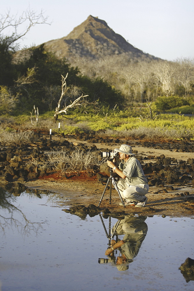 Photo class participant Douglas Wilcox taking images in the Galapagos Island Archipeligo, Ecuador. Model release number DW0507.