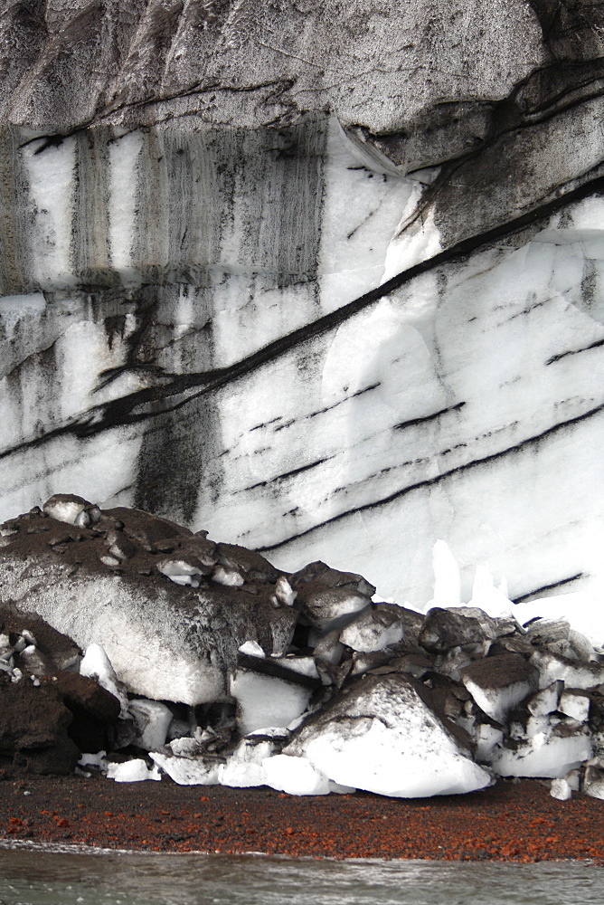 Close up views of glacial ice and ash after the 1969 eruption on Deception Island in Antarctica