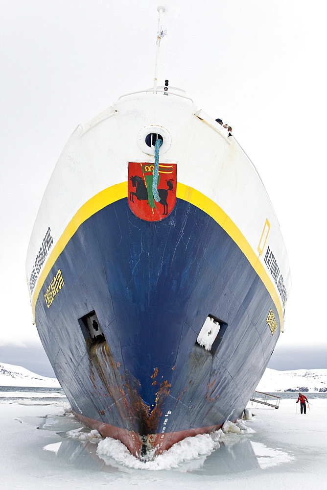 The Lindblad expedition ship National Geographic Endeavour stuck hard and fast in shore fast ice in Port Foster within Decption Island, Antarctica.