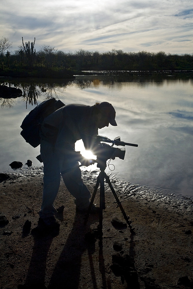 Crew videographer of the Lindblad Expeditions ship the National Geographic Polaris in the waters surrounding the Galapagos Island Archipelago, Ecuador