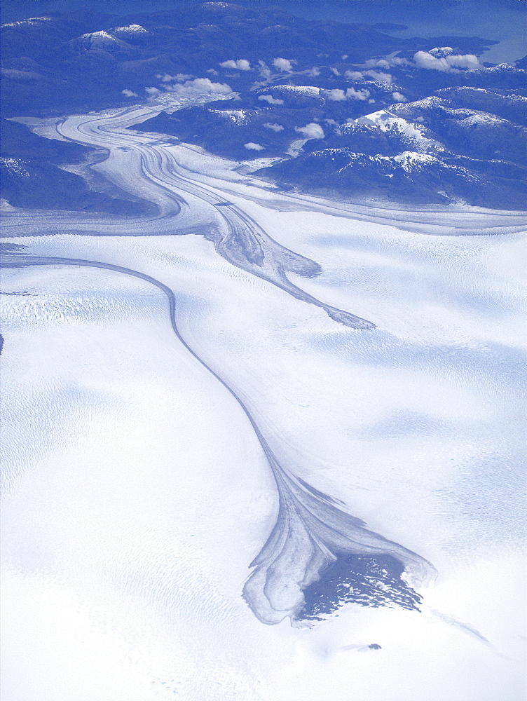 Aerial views of snow-capped mountains, ice fields, and glaciers on a charter flight from Santiago, Chile to Ushuaia, Argentina