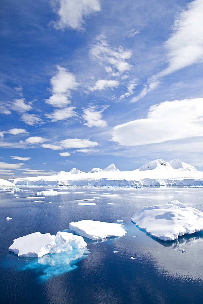 The Lindblad Expeditions ship National Geographic Explorer pushes through ice in Crystal Sound, south of the Antarctic Circle