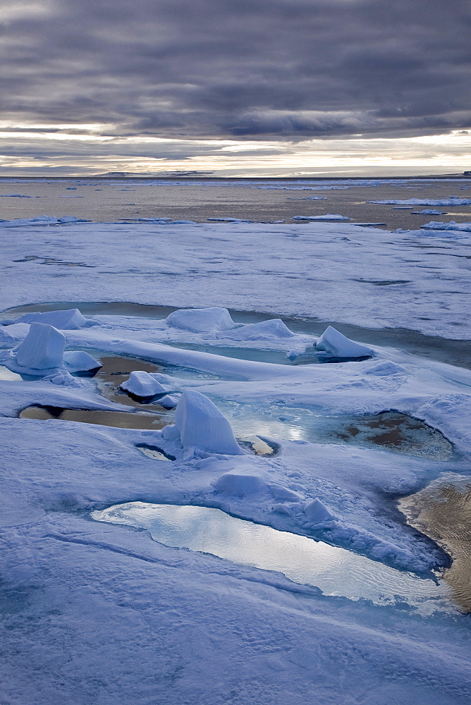 Open leads surrounded by multi-year ice floes in the Barents Sea between EdgeÃ¸ya (Edge Island) and Kong Karls Land in the Svalbard Archipelago, Norway.