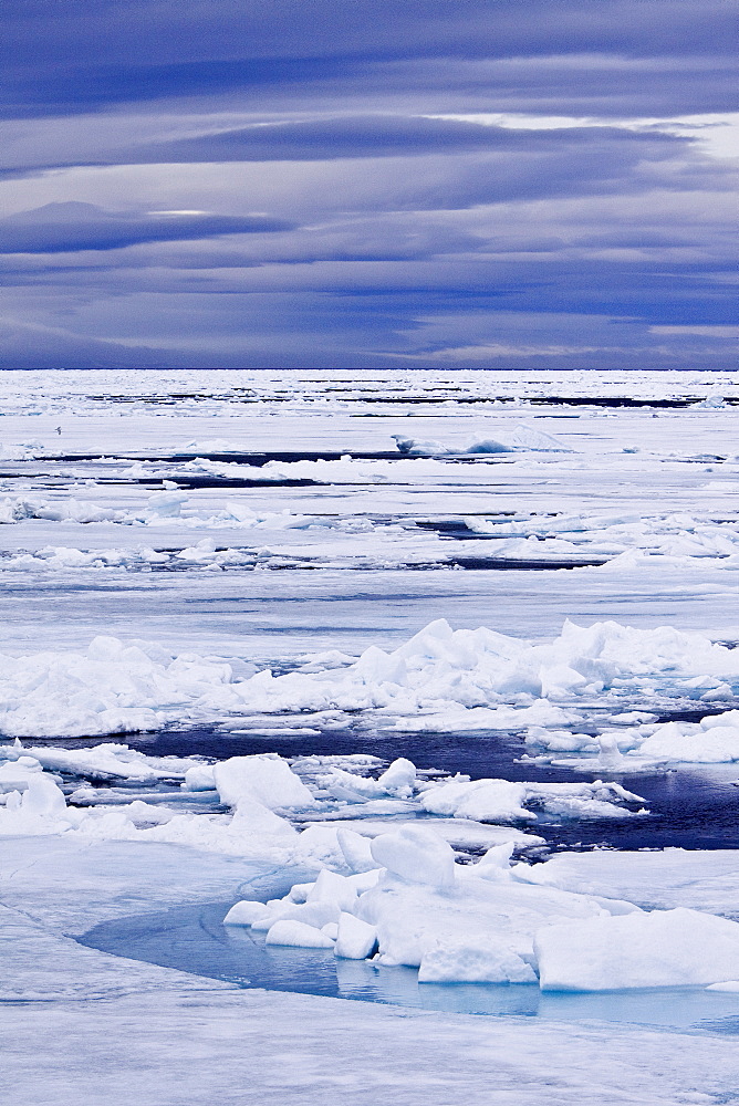 Open leads surrounded by multi-year ice floes in the Barents Sea between EdgeÃ¸ya (Edge Island) and Kong Karls Land in the Svalbard Archipelago, Norway.