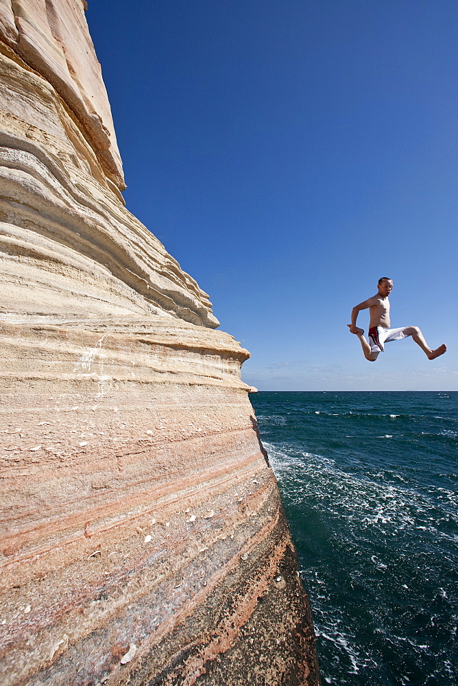 The Lindblad expedition ship National Geographic Sea Lion staff diving off the cliffs at Isla San Jose in the Gulf of California (Sea of Cortez), Mexico