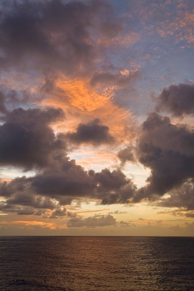 Sunrise or sunset at sea in the Atlantic Ocean from onboard the National Geographic Endeavour crossing the Atlantic Ocean from Lisbon, Portugal to Salvador, Brazil.