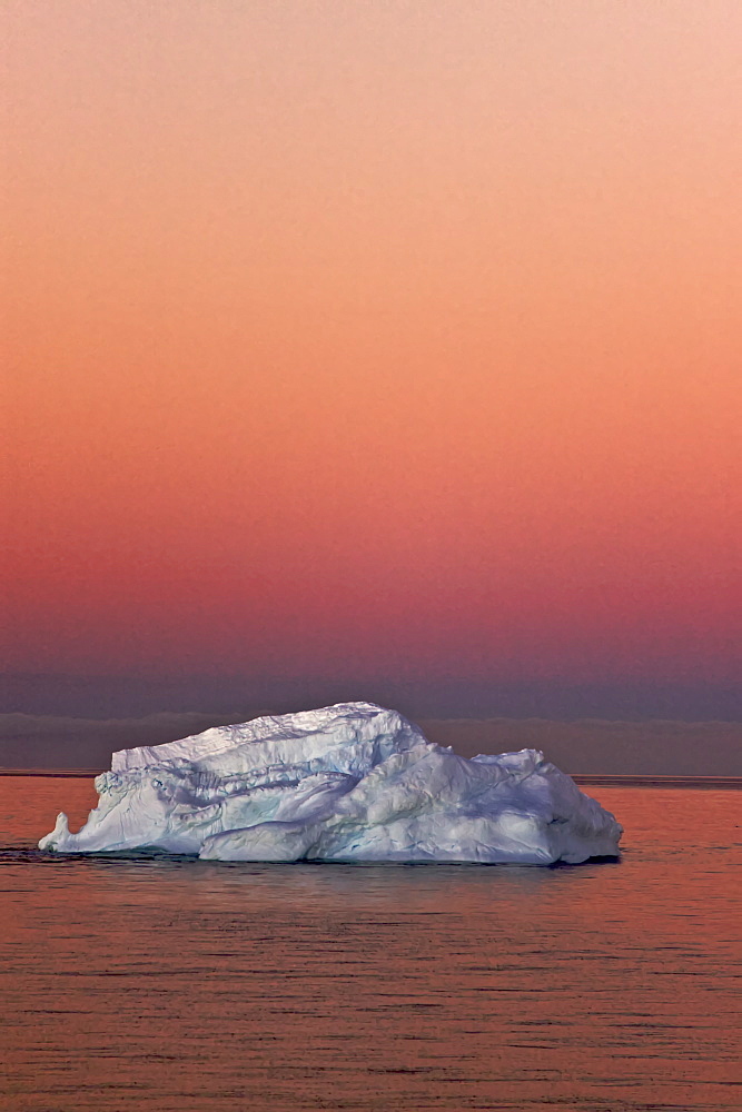 The Lindblad Expedition ship National Geographic Explorer in late evening light as the sun sets in the northwest side of the Antarctic Peninsula in Antarctica. 