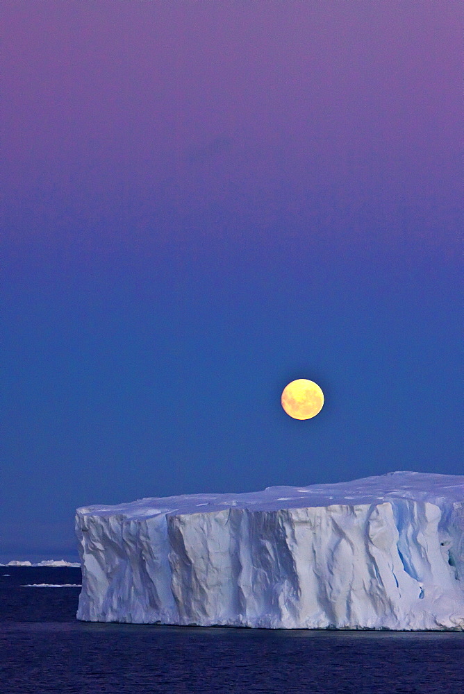 Full moon (plus 1 day) rising over icebergs in the Weddell Sea, Antarctica. MORE INFO This moonrise occurred on January 1, 2010, the night after the blue moon full of December 31, 2009.