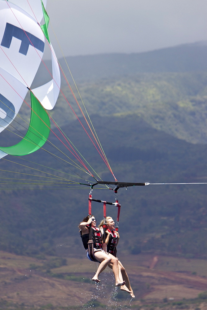 Commercial parasailing operations off the west side of the island of Maui, Hawaii, USA. MORE INFO Parasailing in Hawaii is limited seasonally to times of the year when humpback whales are not present.