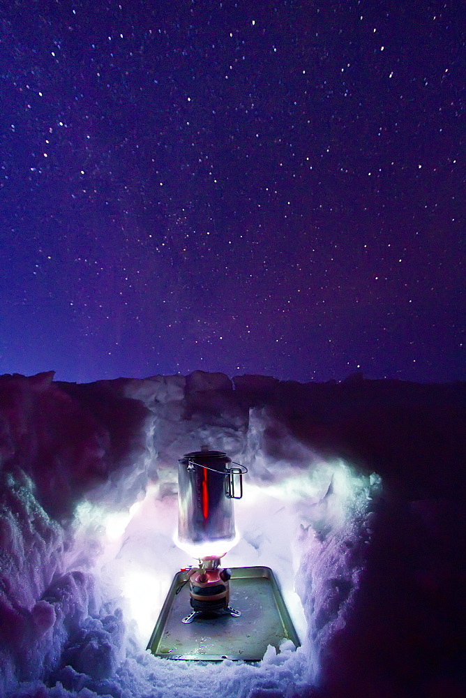 Canadian photographer Gilles Pucheu boils water for dinner near his home in Yellowknife, Northwest Territories, Canada. 