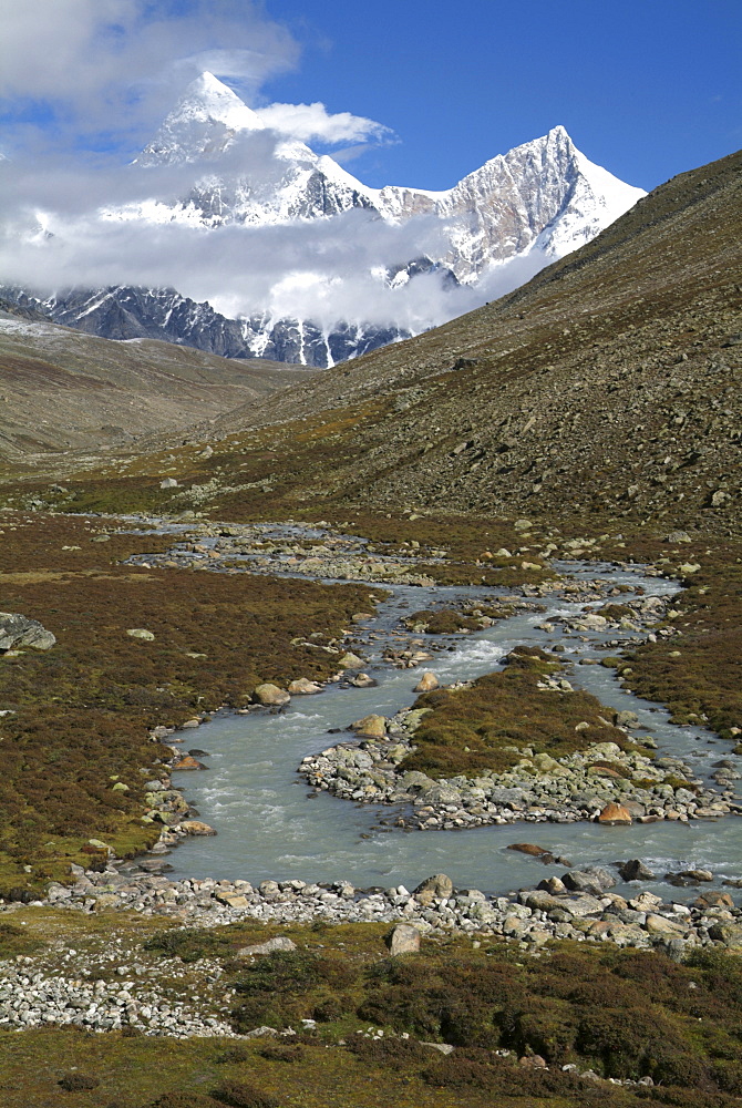 Tibetan  Mountain and Clouds. Glacier River,  Himalayas, Tibet.