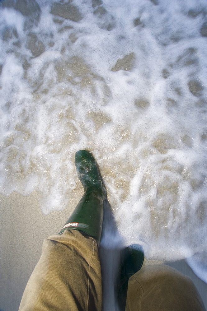 Walking in the surf at dusk, Tiree, Scotland