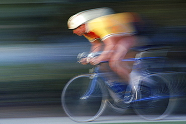 A bike racer speeds along in Los Angeles / San Diego, CA.