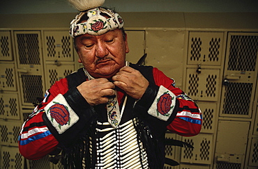 In the hallways of Central High School, St. Paul, Minnesota at a Pow Wow held by the local Indian communities.Dancers and getting ready in the men's locker room and drummers performing in the school gymnasium.