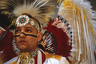 In the hallways of Central High School, St. Paul, Minnesota at a Pow Wow held by the local Indian communities. Dancers and getting ready in the men's locker room and drummers performing in the school gymnasium.