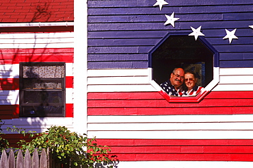 Wally and Hellen Rogers of Standish, Maine proudly display their home which is painted on all sides like the American Flag. Long before 9, 11 and the rejuvenation of patriotism and the increased display of Old Glory, the Rogers decided to wear their pride blatantly on the outside walls of their home.