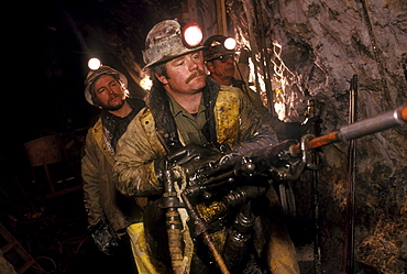 Hardrock miners working in the Sunnyside Mine, a large underground gold mine near Silverton, Colorado. The mine is now closed.