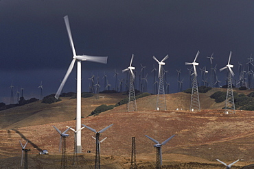 Hightech windmills, some standing 500 feet high when their blades are vertical, hum on the Altamont Pass of California as they produce clean electricity.