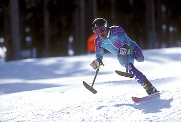 A disabled (amputee) skier, also known as a three-track skier, speeds down a practice race course during a training session for the U.S. Disabled Ski Team at Purgatory Ski Resort near Durango, Colorado