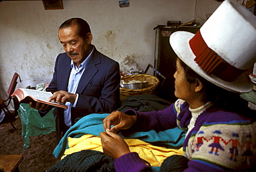 Cuzco evangelist Raul Huaco stops for a prayer with friend Calixta Cruz in the village of Angostura, south of the city of Cuzco. Personal attention by local evangelists and the ability to participate in church services often attracts disenchanted Catholics who have little say in the operation of their churches. This image is part of a five-part series on the rise of evangelical Protestantism in Latin America.