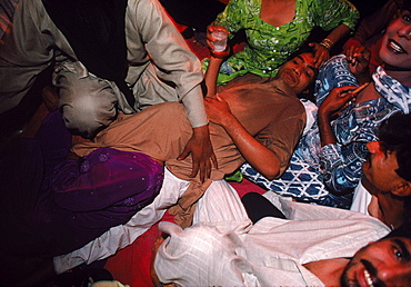 Hijras attend a ritual birth ceremony whereby a Hijra "mother" gives birth to her "daughter"