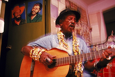 Baracoa, Oriente Cayamba, local legend and troubador/poet sings for visitors.