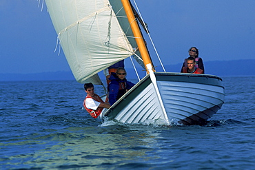 The Petrel and the Guillamont, two pulling boats, part of the Chewonki Foundation's fleet, head out of Wiscasset on an orientation trip for Bodwin College freshmen. The boats sail down the Back River. This non-profit Foundation, formerly a boys camp where Roger Tory Peterson directed the nature program in the 1920's, provides environmental programs throughout the year for a diverse number of groups throughout Maine and offers participation in residential and non-residential programs in environmental education.