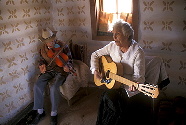 Hispanic folk musicians at El Rancho de Las Golondrinas, a recreated Hispanic theme village for visitors near Santa Fe, New Mexico