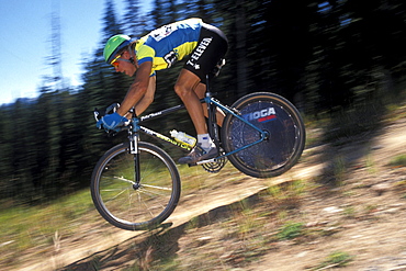 Well known racer, John Tomac, races in the 1990 World Mountain Bicycle Championships held in Durango, Colorado. Durango was and has been a Mecca for Mountain bikers throughout the nation. The 1990 championships were the first ever unified world championships.