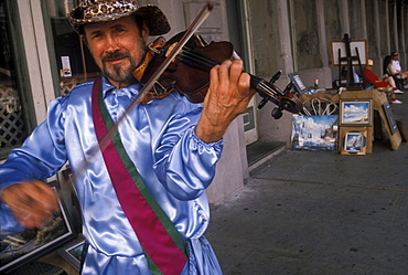 A musician performs during Mardi Gras celebrations in Galveston, Texas