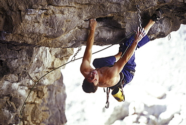 Matt Ciancio struggles to clip his rope on a very steep climb in the Owens River Gorge, California.