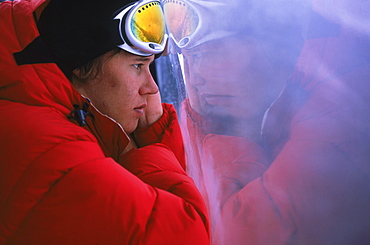 Snowboarder Heikki Sorsa stares out of foggy gondola window