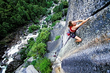 Beth Rodden rock climbing, crack climbing on the famous Phoenix 5.13a finger crack in Yosemite National Park, California.