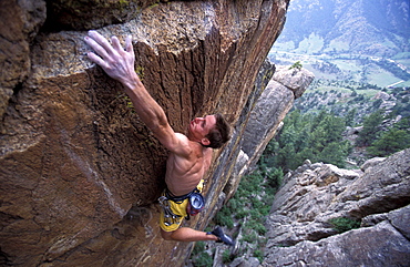 Tommy Caldwell rock climbing Grand Ol' Opry 5.14b at the Monastery near Estes Park, Colorado. Caldwell is one of the worlds leading climbers, despite having cut off one of his fingers.