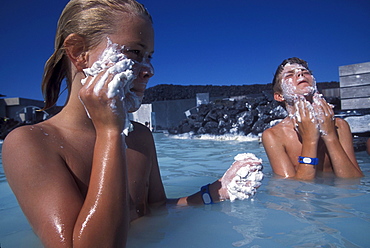 An Icelandic boy and an American boy enjoy the healing powers of mud at the Blue Lagoon, near Reykjavik, Iceland.