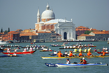 Participants of Vogalonga, a 32 km jaunt from the Bacino de San Marco up to Burano and back down to the Grand Canal via Cannaregio, on boats of all descriptions (powered by human muscle), on canal San Marco, in Venice, Italy on June 15, 2004.