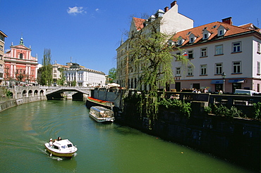 The Ljubljanica River flowing under the Triple Bridge and through Ljubljana, Slovenia's Old Town.