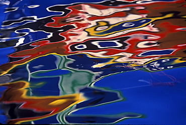 Reflection of colorful fishing boat in harbor-Mgarr,Gozo Malta