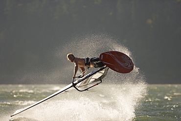 Rob Warwick lets it all hang out, performing a "Shove It" at The Hatchery, Hood River, Oregon