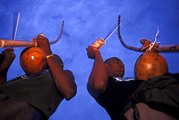 In the small village of Itacare, two Capoeira musicians play the birimboa, a gord and string instruments used for rhythem in the Brazilian martial art-like dance, that originated with slaves in Bahia.