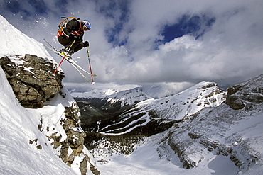 Sven Brunso catches air while skiing Delirium Dive at Sunshine Village Ski Resort in Banff National Park, Alberta, Canada.