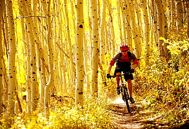 Alex Grant rides his bike on a dirt trail in Park City, Utah.