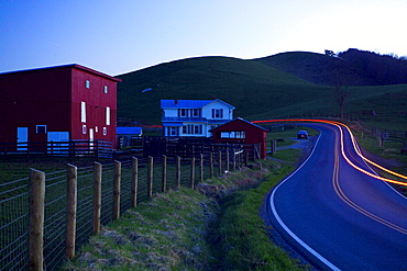 A car's taillights illuminate the road near a farm in Pleasant Valley, Floyd, Virginia on April 9, 2005. (Jonathan Kingston, Aurora)