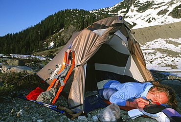 Senja Palonen sleeps in her tent after setting up camp below Ossa Mountain in the Tantalus Range, British Columbia