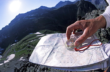 Patrick Harper uses a compass and a topographic map to navigate through the mountains above Ouray, Colorado. Harper, a member of Team Montrail, was practicing his navigation skills for the Primal Quest adventure race. Harper trained in the mountains above Ouray, Colorado for a month before the event to get better acclimatized to the high elevation.