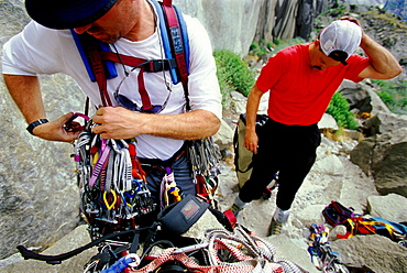 Martin Avidan and Bob Porter prepare to aid climb up the first pitch of Zodiac, a 16 pitch 5.11 A3+, route in Yosemite National Park, California.