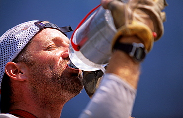 Martin Avidan taking a water break while climbing Zodiac, a 16 pitch 5.11 A3+ on El Capitan in Yosemite National Park, California.